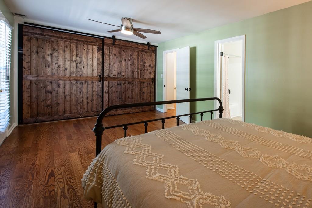 408 Sycamore Drive, Unit D Decatur, GA 30030 - Photo 16 of 63 a bedroom with a bed a mirror and a window
