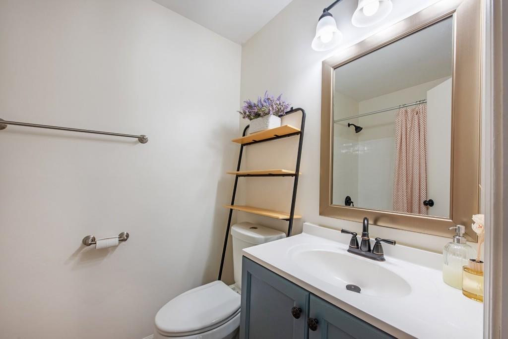 408 Sycamore Drive, Unit D Decatur, GA 30030 - Photo 20 of 63 a bathroom with a sink vanity mirror and toilet