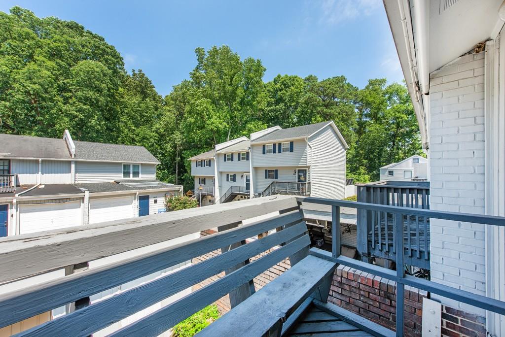 408 Sycamore Drive, Unit D Decatur, GA 30030 - Photo 21 of 63 a view of a house with wooden deck and furniture