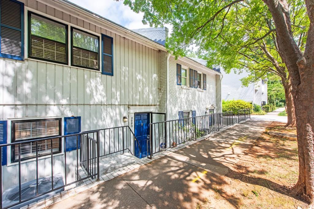 408 Sycamore Drive, Unit D Decatur, GA 30030 - Photo 36 of 63 a view of a house with a large window and wooden fence