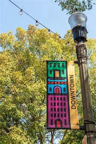 a view of a street with cars on the road