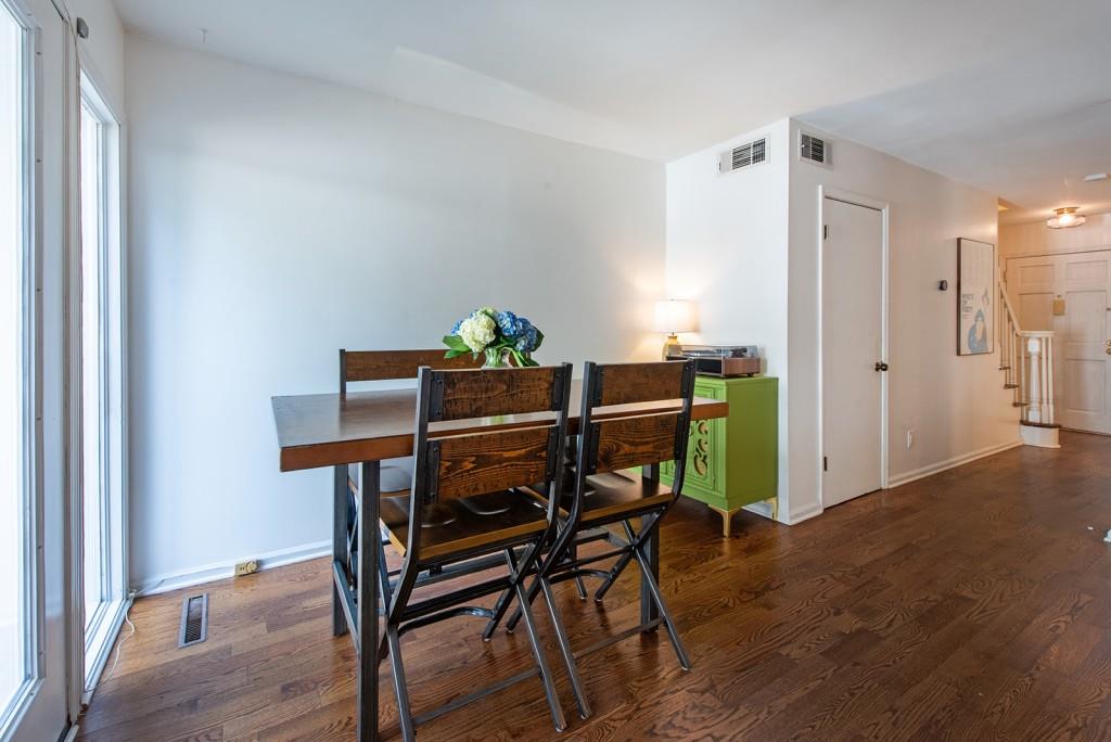408 Sycamore Drive, Unit D Decatur, GA 30030 - Photo 7 of 63 a view of a dining room with furniture and wooden floor