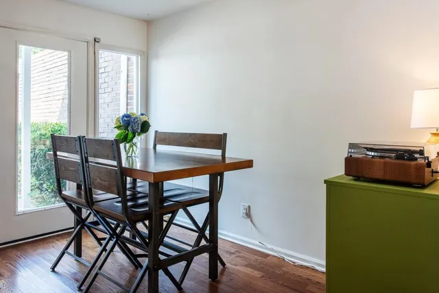 a dining room with furniture and window