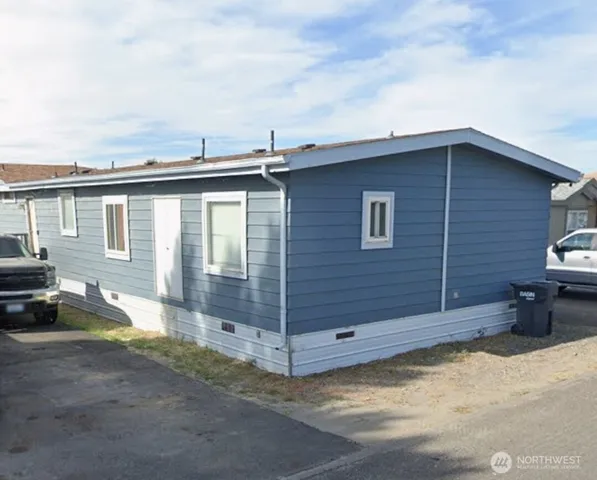 a view of a house and a yard