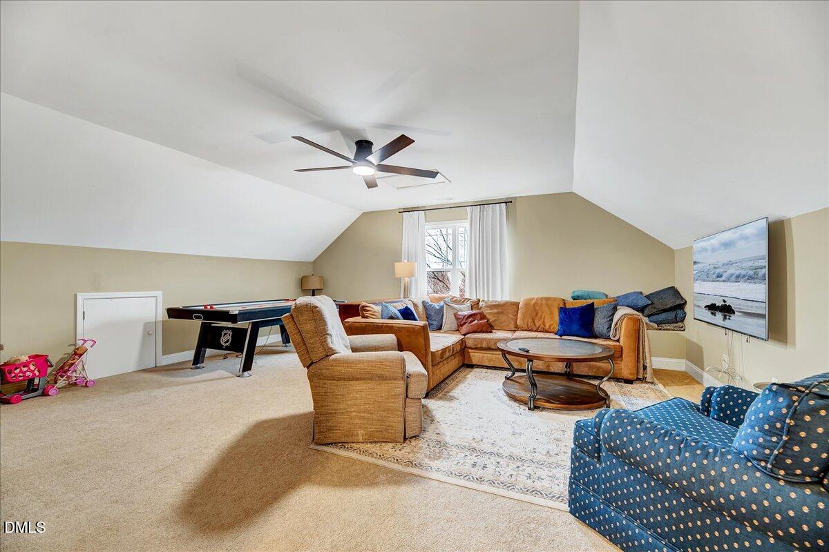 454 Big Willow Way Rolesville, NC 27571 - Photo 13 of 50 a living room with furniture and a flat screen tv