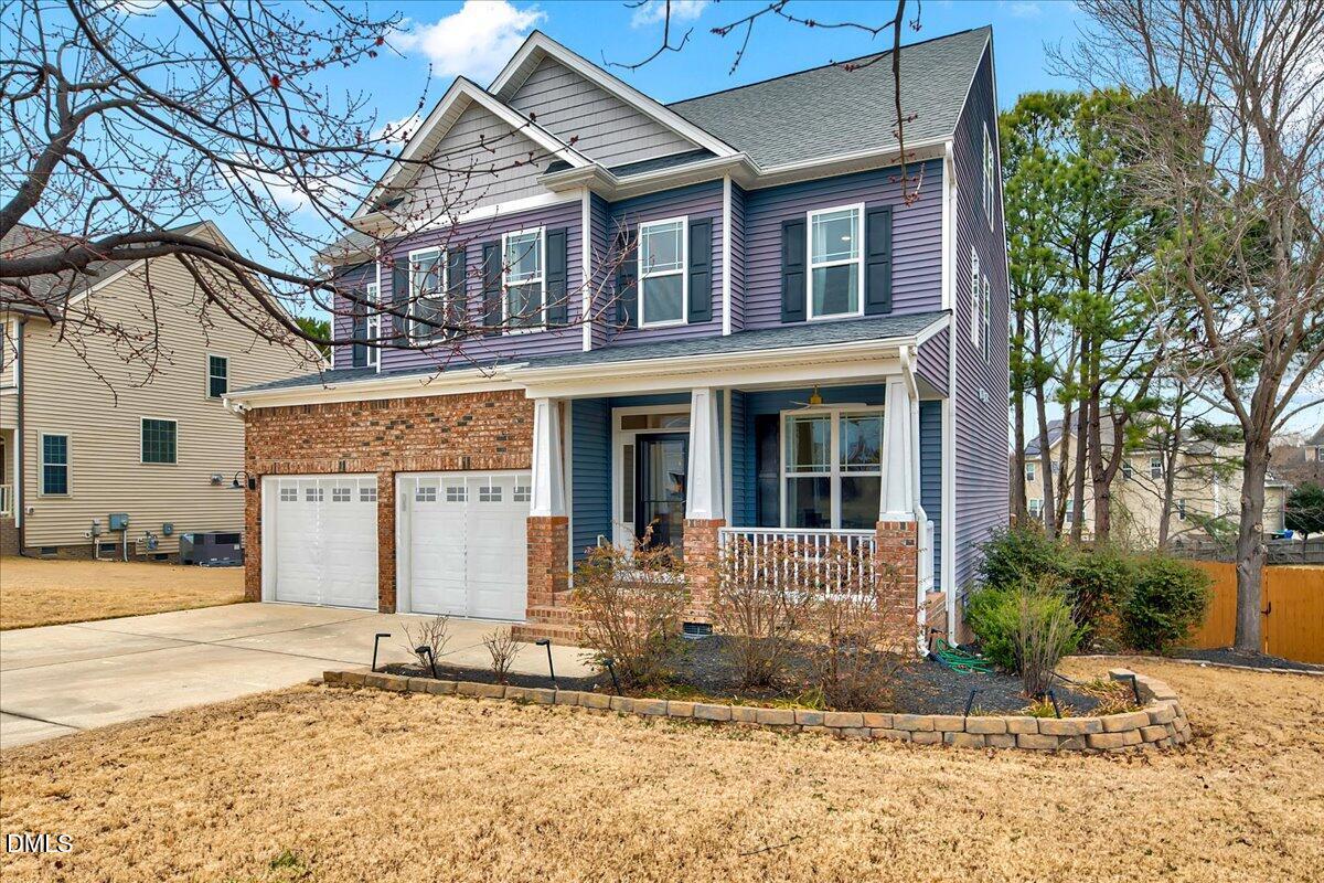 454 Big Willow Way Rolesville, NC 27571 - Photo 2 of 50 a front view of a house with a yard