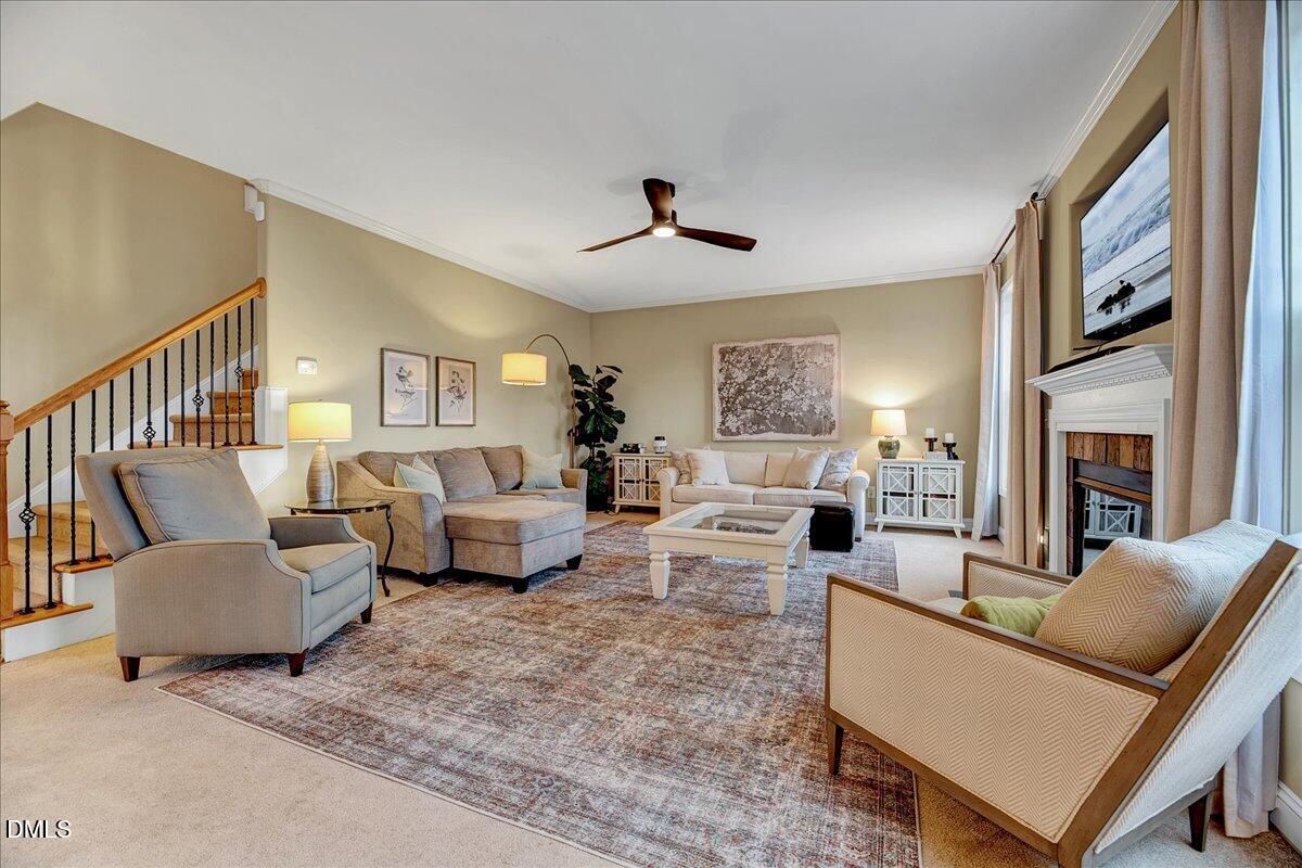 454 Big Willow Way Rolesville, NC 27571 - Photo 10 of 50 a living room with furniture and a fireplace