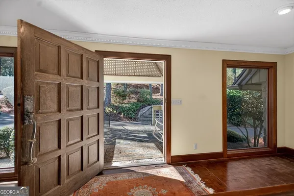 a view of entryway with wooden floor