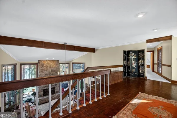 a view of an entryway wooden floor and windows