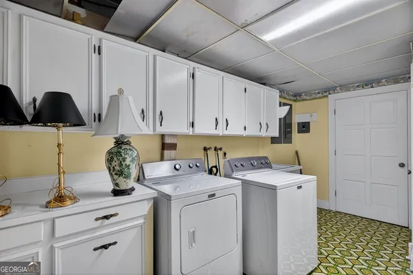 a utility room with dryer and washer