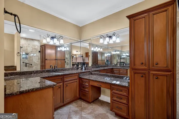 a kitchen with stainless steel appliances granite countertop a sink and a counter space