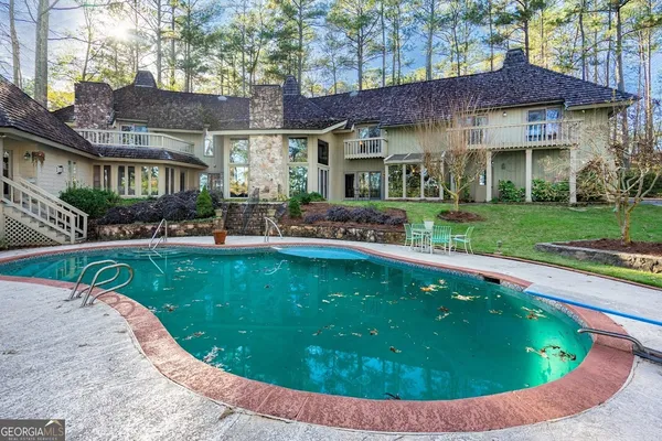 front view of a house with a yard table and chairs