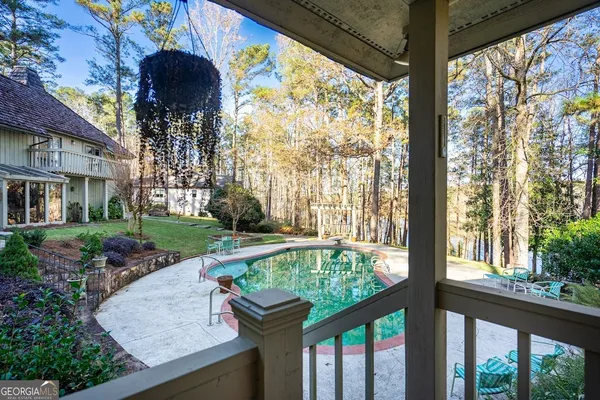 a view of swimming pool from a balcony