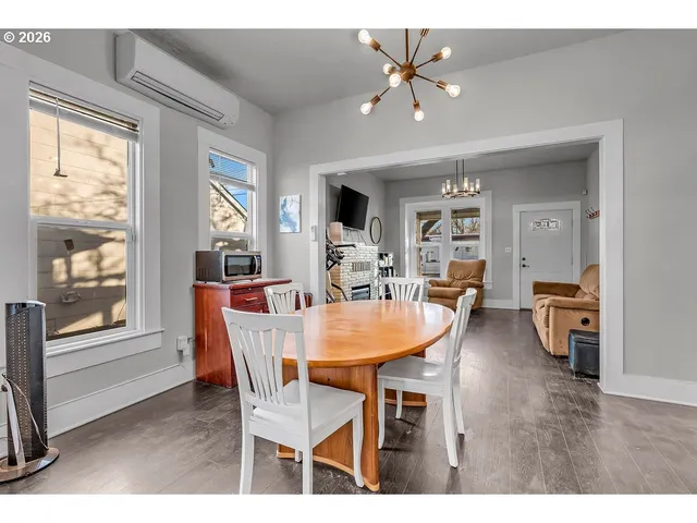 a kitchen with stainless steel appliances white cabinets and a refrigerator