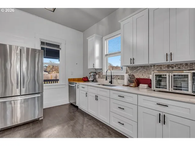 a kitchen with a sink and cabinets