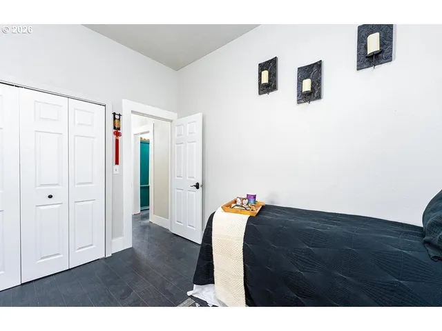 a view of a livingroom with workspace and a window