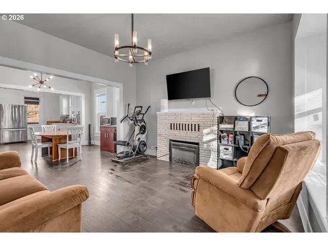 a view of a livingroom with furniture and gym equipment