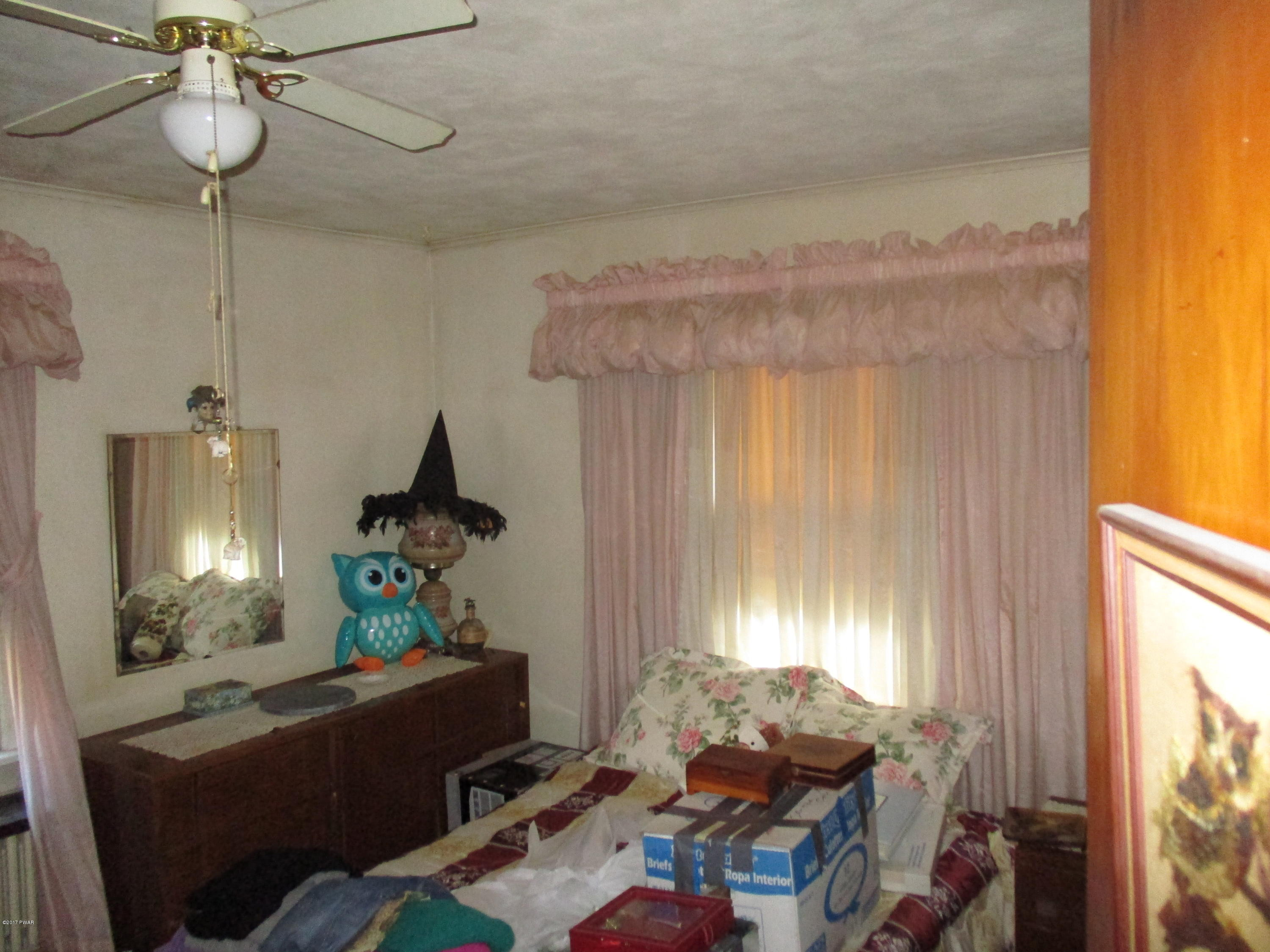 142 Log Tavern Road Milford, PA 18337 - Photo 15 of 24 a living room with furniture and a window