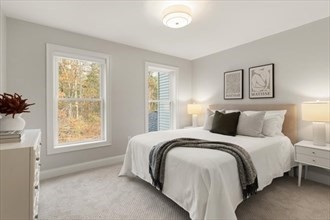 10 Barrack Hill Road, Unit 10 Rutland, MA 01543 - Photo 9 of 11 a bedroom with a bed and a window