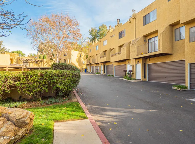 a view of a back yard of the building