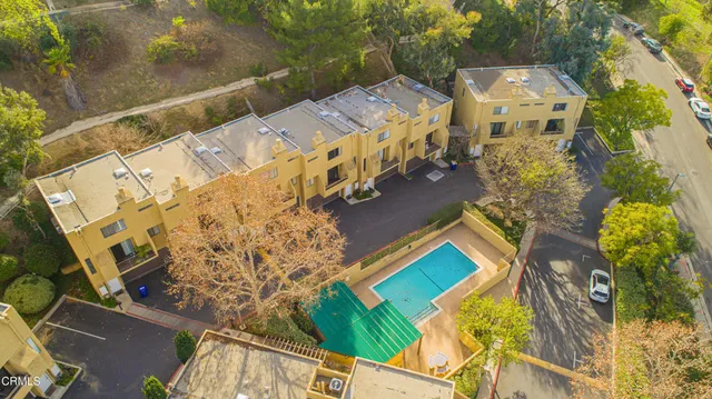 an aerial view of residential house and green space