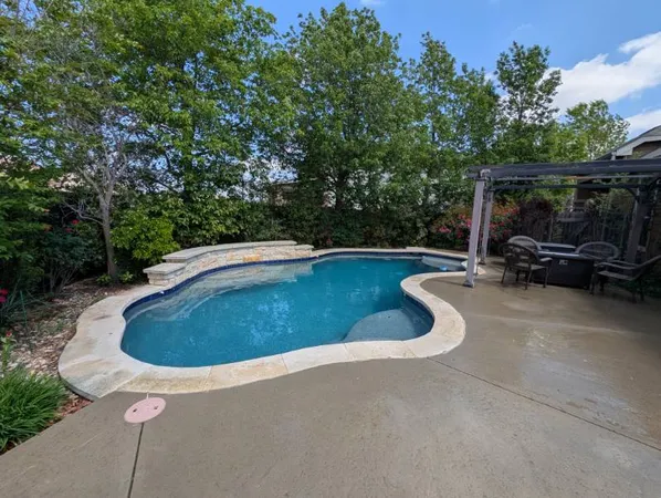 a view of outdoor space pool patio and yard