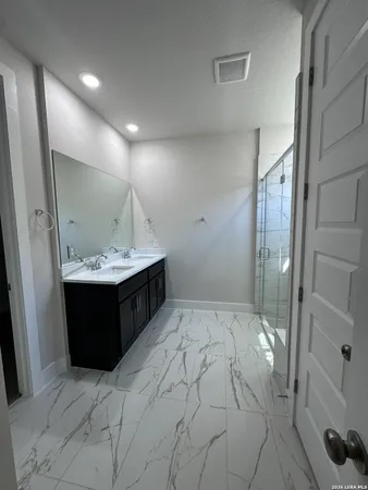 a bathroom with a bathtub and a sink