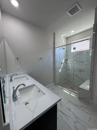 a bathroom with a sink and mirror