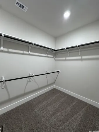 a view of an empty walk in closet