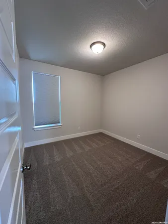 an empty room with a empty space and window