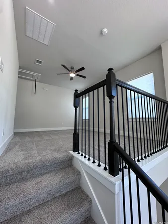 a view of a hallway with staircase