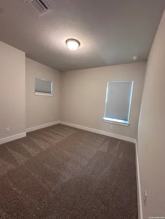 an empty room with a empty space and window