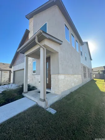 a view of a house with backyard and garden