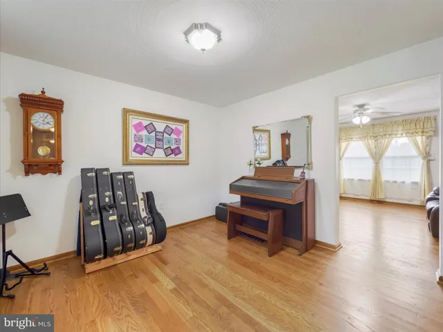 a room with furniture and wooden floor