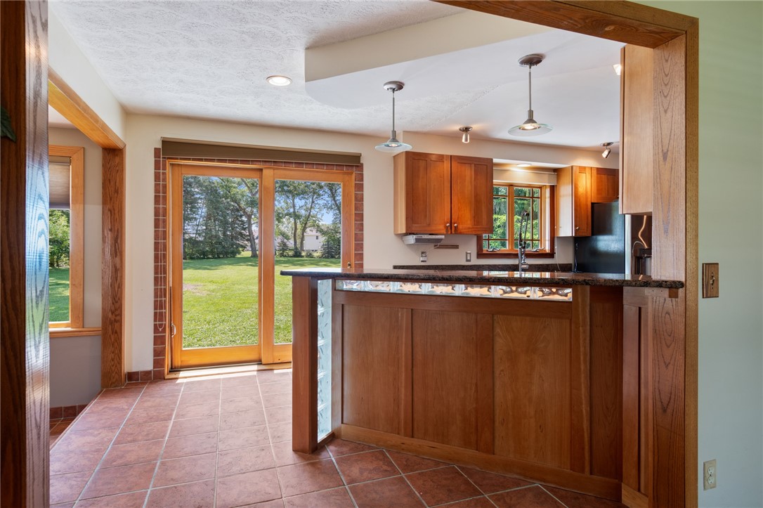 1213 State Road Webster, NY 14580 - Photo 13 of 38 The breakfast bar - granite and butcher block -pen