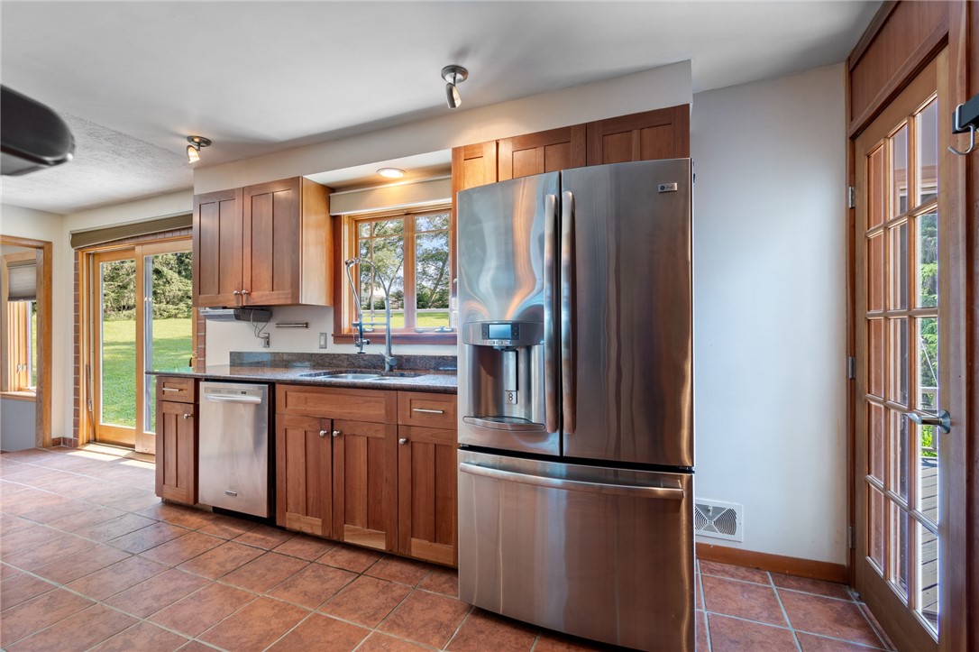 1213 State Road Webster, NY 14580 - Photo 14 of 38 Walk out to the deck from the slider of the door t