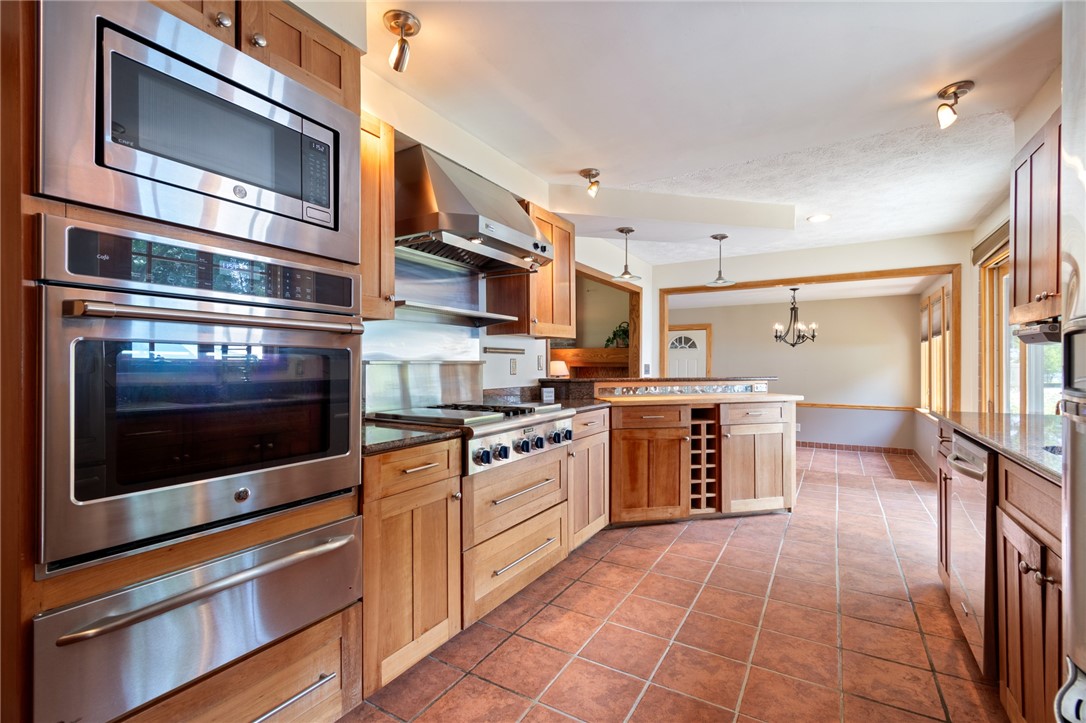 1213 State Road Webster, NY 14580 - Photo 16 of 38 The custom wood work in the kitchen is top notch!
