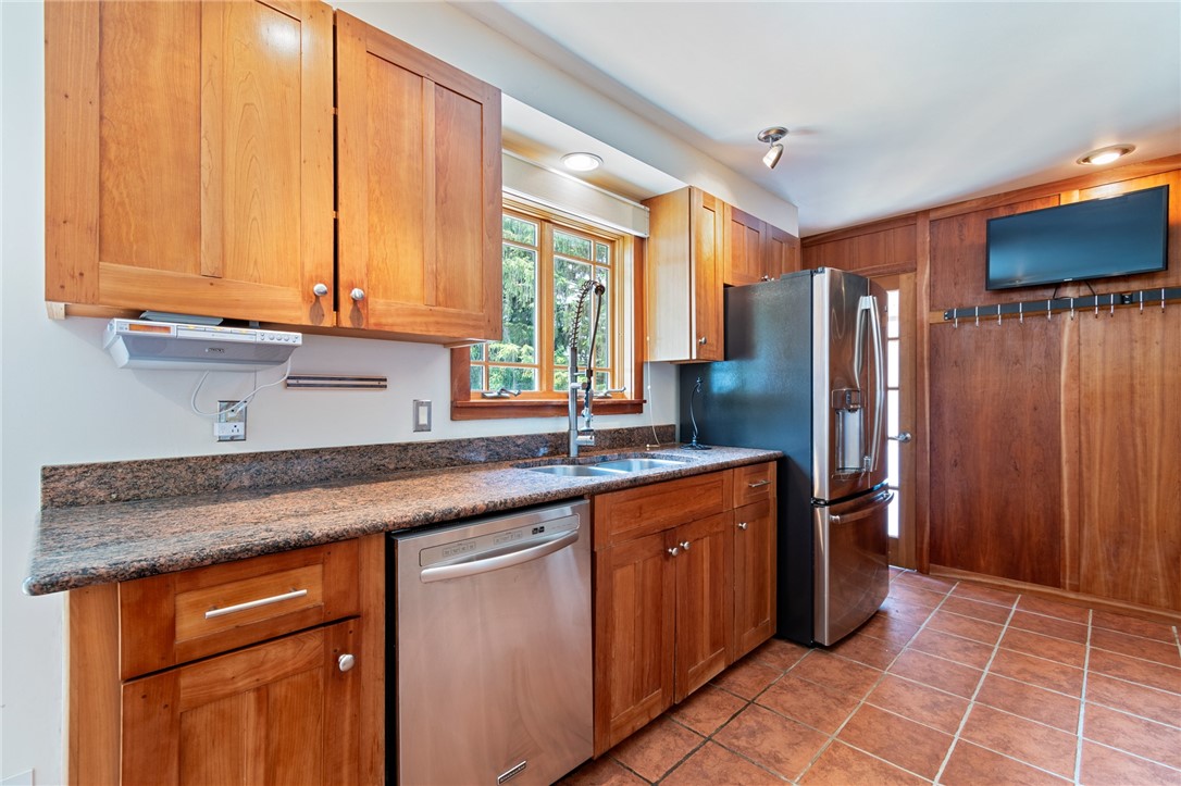 1213 State Road Webster, NY 14580 - Photo 17 of 38 The pot hangers and wall flat screen are nice touc