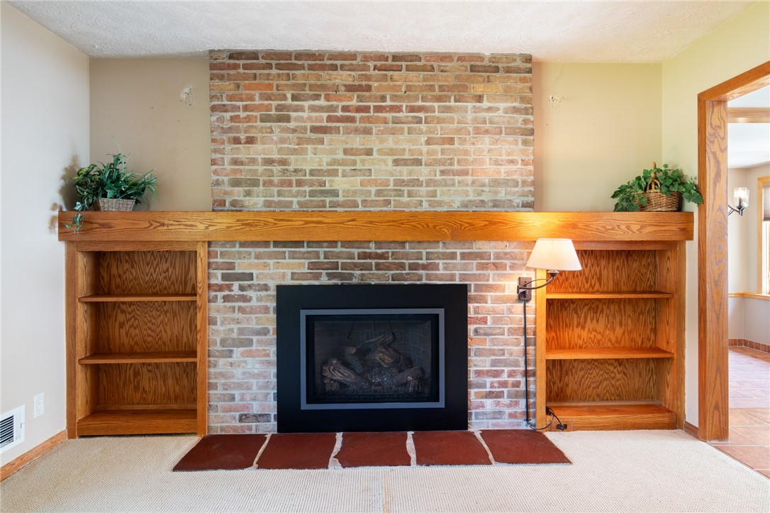 1213 State Road Webster, NY 14580 - Photo 18 of 38 The bookshelves that flank the fireplace are a gre