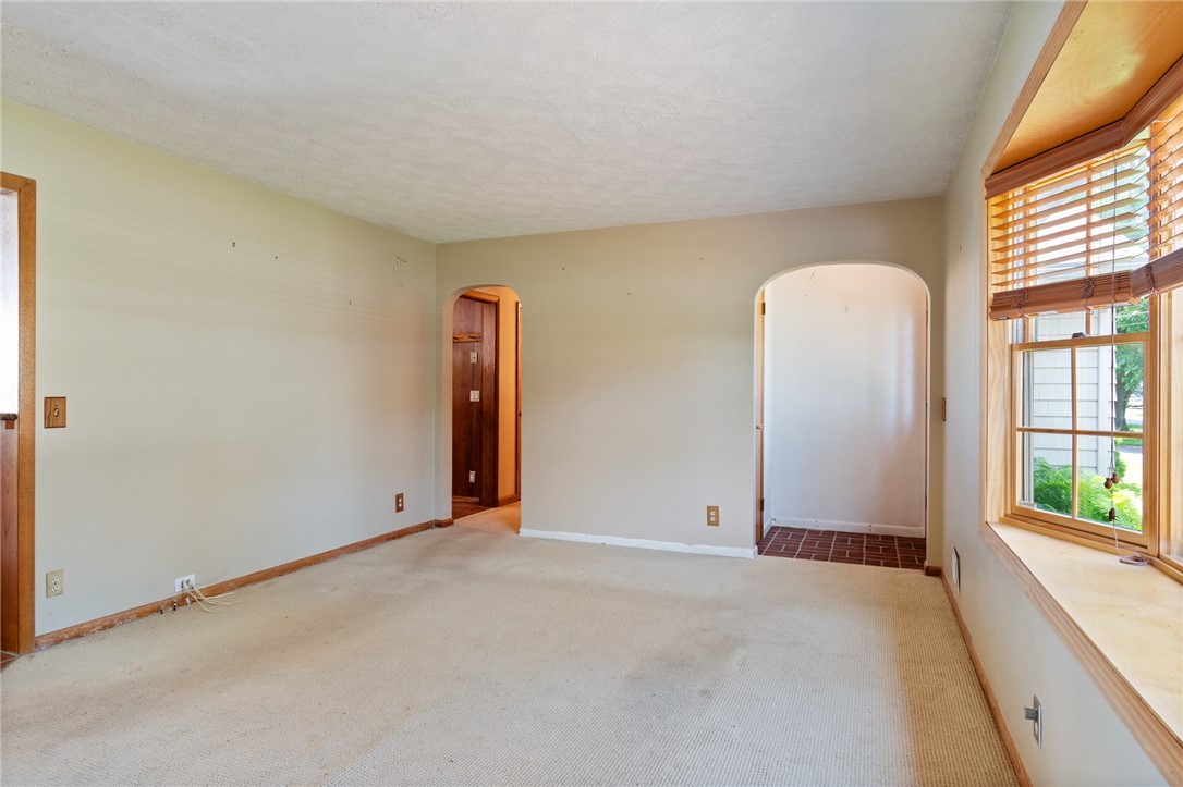 1213 State Road Webster, NY 14580 - Photo 19 of 38 To the front door entrance and the hall to the bed