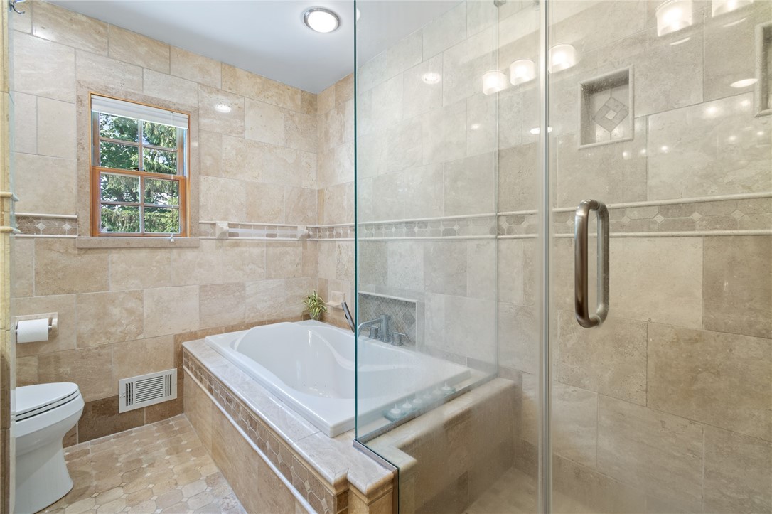 1213 State Road Webster, NY 14580 - Photo 22 of 38 The CUSTOM TILE BATH - walk in shower and soakin