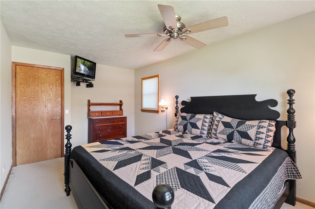 1213 State Road Webster, NY 14580 - Photo 24 of 38 The primary bedroom - that’s a California King!