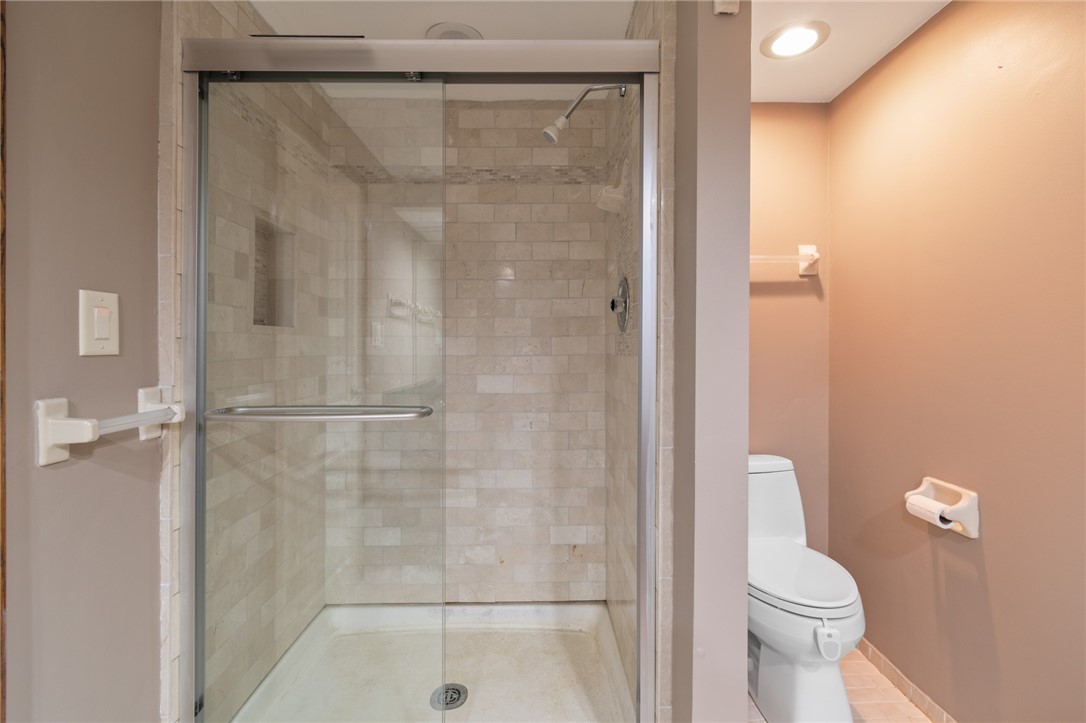 1213 State Road Webster, NY 14580 - Photo 32 of 38 The CUSTOM tile in the lower level shower