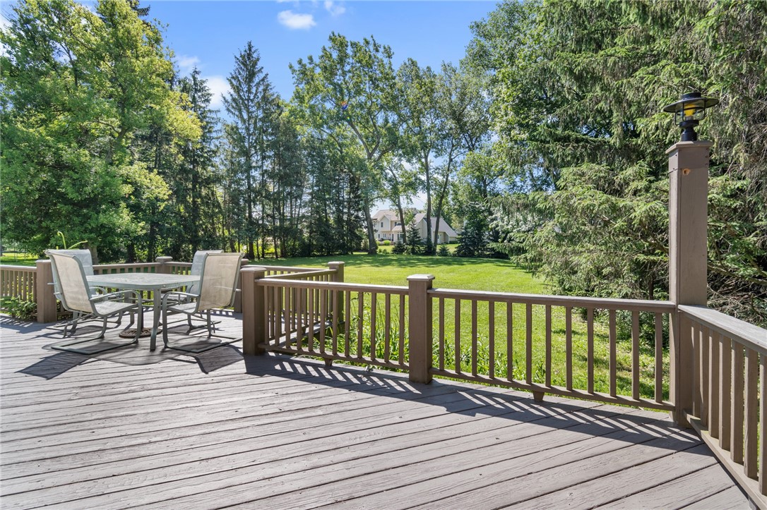 1213 State Road Webster, NY 14580 - Photo 6 of 38 The freshly stained rear deck - covers the entire
