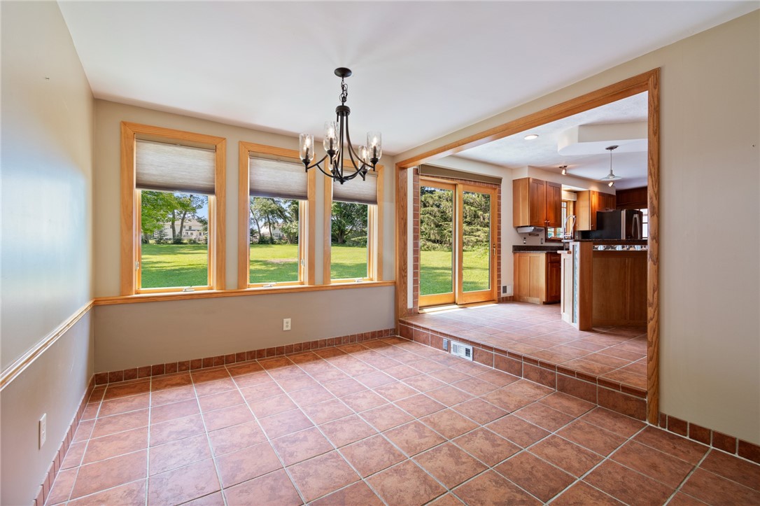 1213 State Road Webster, NY 14580 - Photo 9 of 38 The dining area to the kitchen- nite the slider to