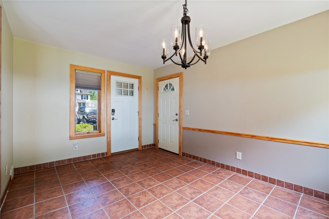 1213 State Road Webster, NY 14580 - Photo 10 of 38 The entrance at the front porch door.