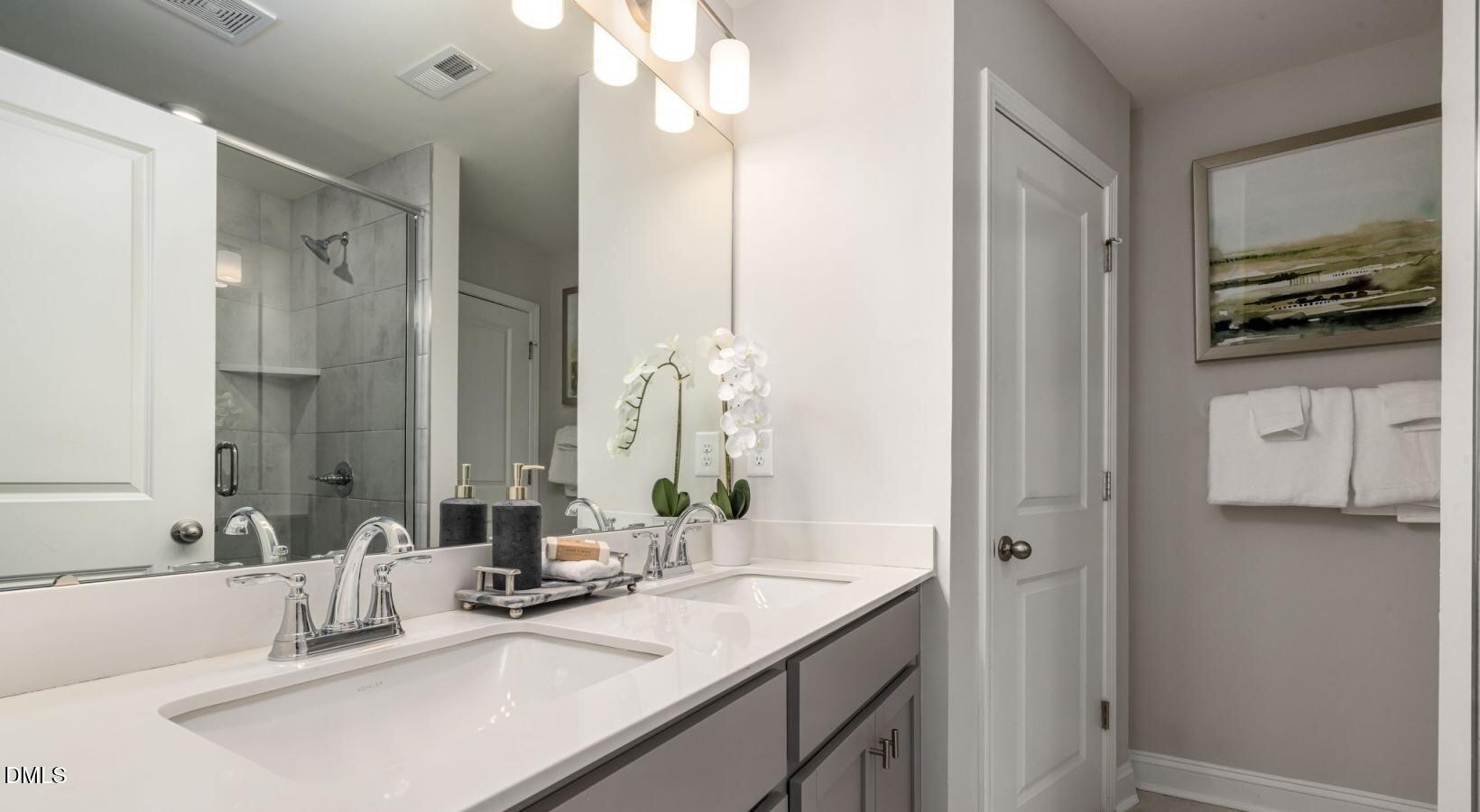 556 Hatters Mill Road, Unit PORTER Wake Forest, NC 27587 - Photo 5 of 12 a bathroom with a sink and a mirror