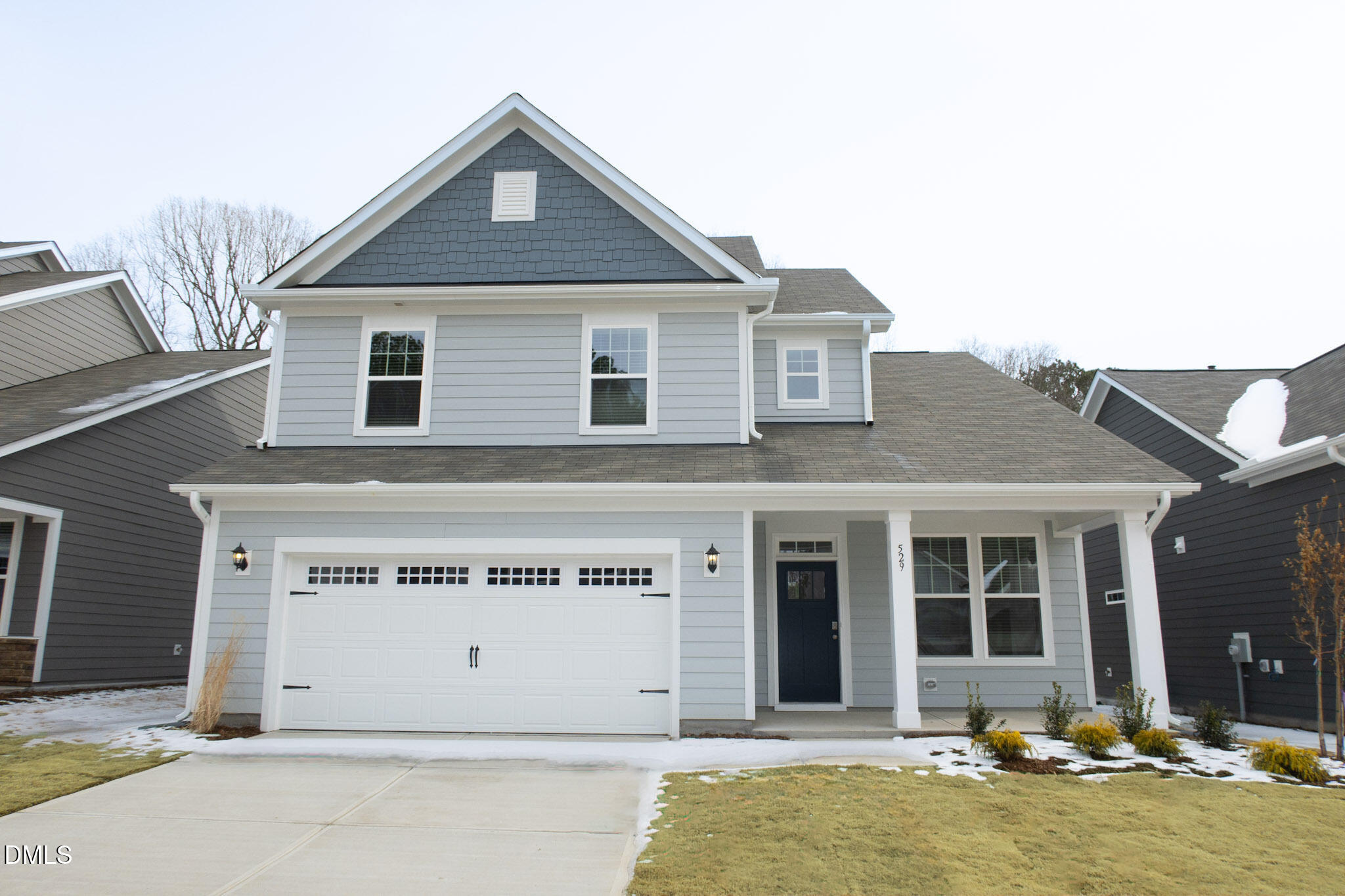 556 Hatters Mill Road, Unit PORTER Wake Forest, NC 27587 - Photo 8 of 12 a front view of a house with a yard