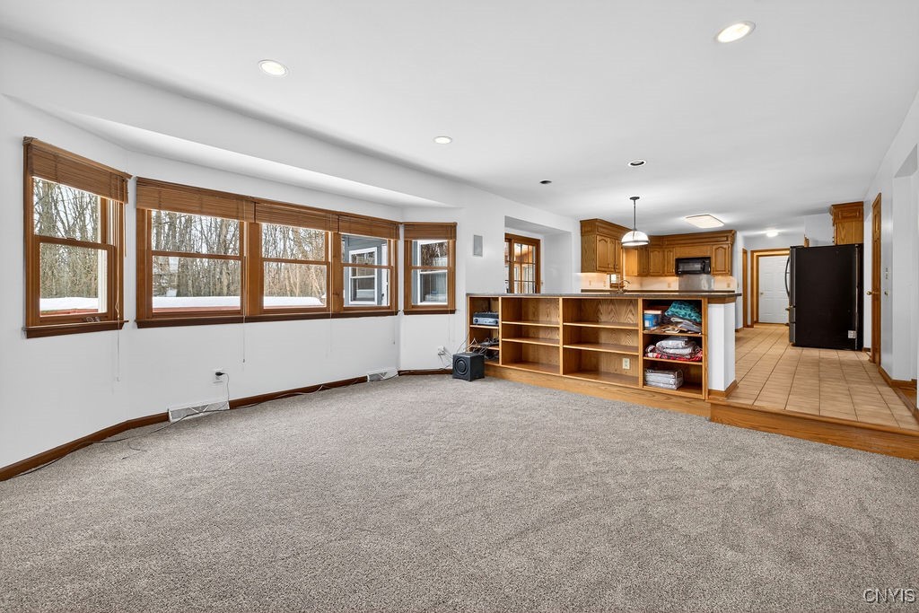 2788 Hiltonwood Road Lysander, NY 13027 - Photo 24 of 50 Large family room with many windows overlooking wo