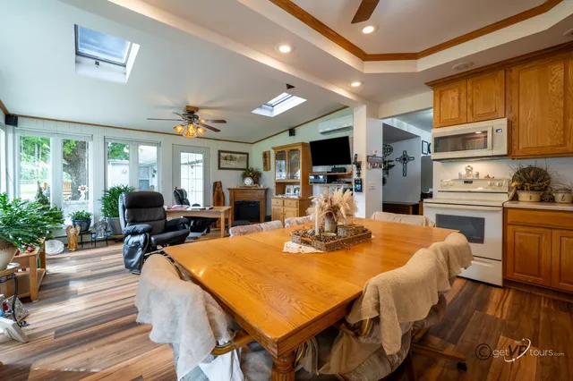 a view of a dining room with furniture window and wooden floor